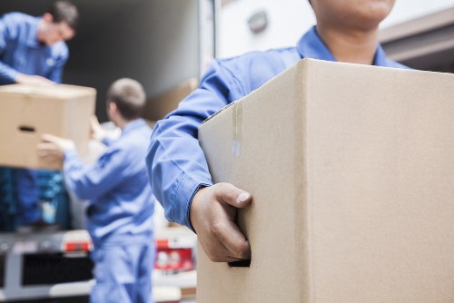 Office moving team handling desks and boxes in Roehampton
