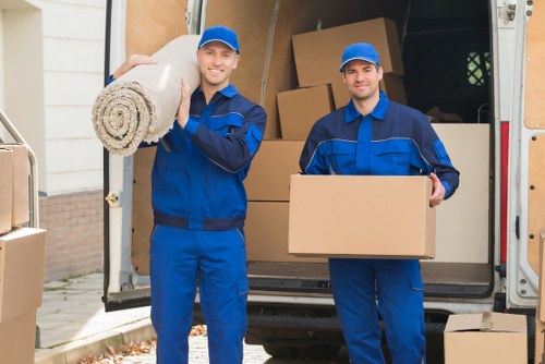 Staff handling furniture carefully during a Roehampton move