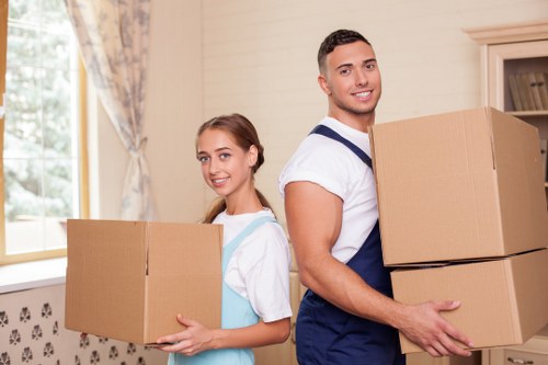 Local piano movers handling a staircase move in Roehampton